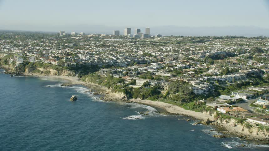 Slow Motion Aerial View of the Orange County coastline