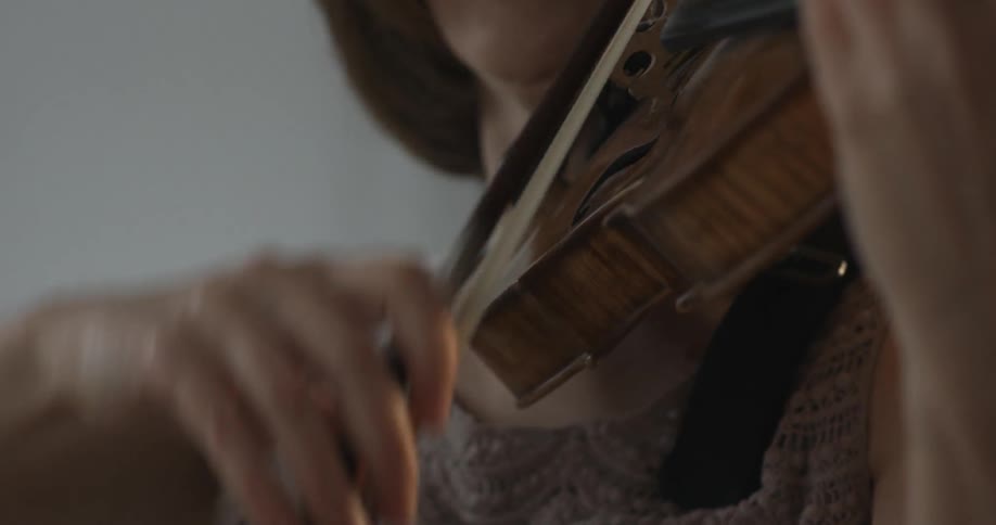 Close up of a woman playing a violin