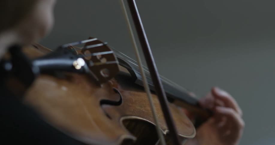A person is playing a violin