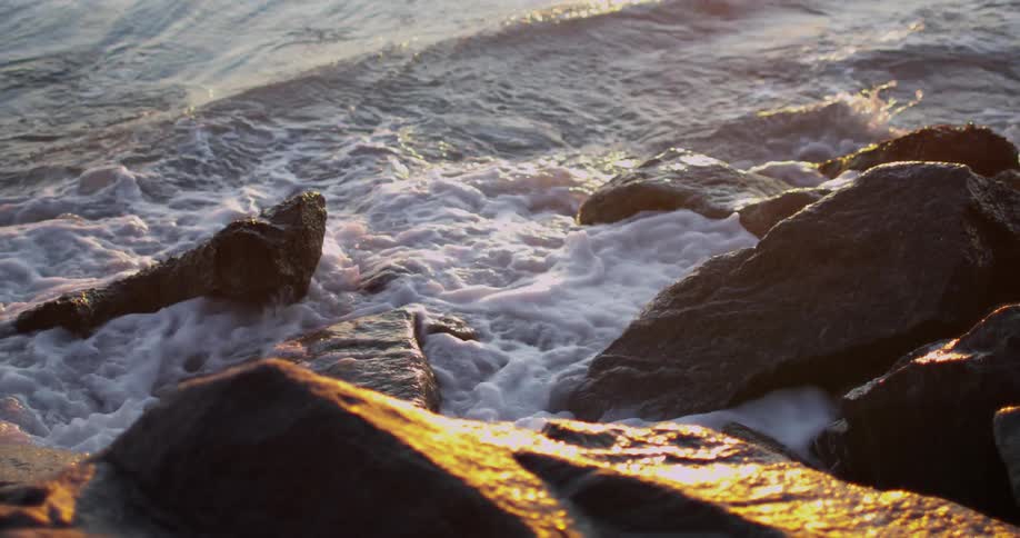 Waves break and crash against the rocks