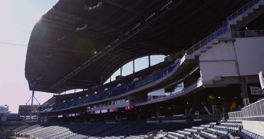 A sports stadium is shown on a sunny day
