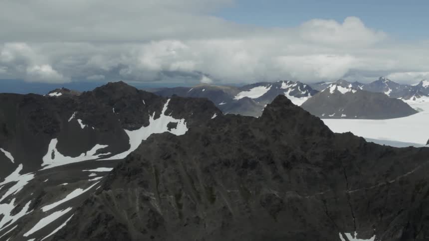 Aerial view of mountain range with snow
