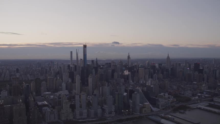 Aerial view of the skyscrapers and tall buildings at dusk