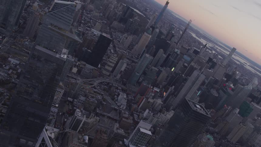 Aerial view of the tall buildings and skyscrapers at dusk