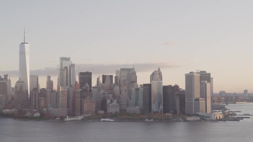 A coastal city with buildings and skyscrapers with the sky in the background