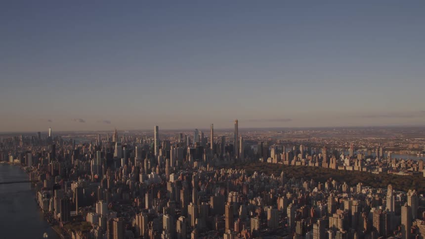 Aerial view of the high rise buildings and skyscrapers next to the river