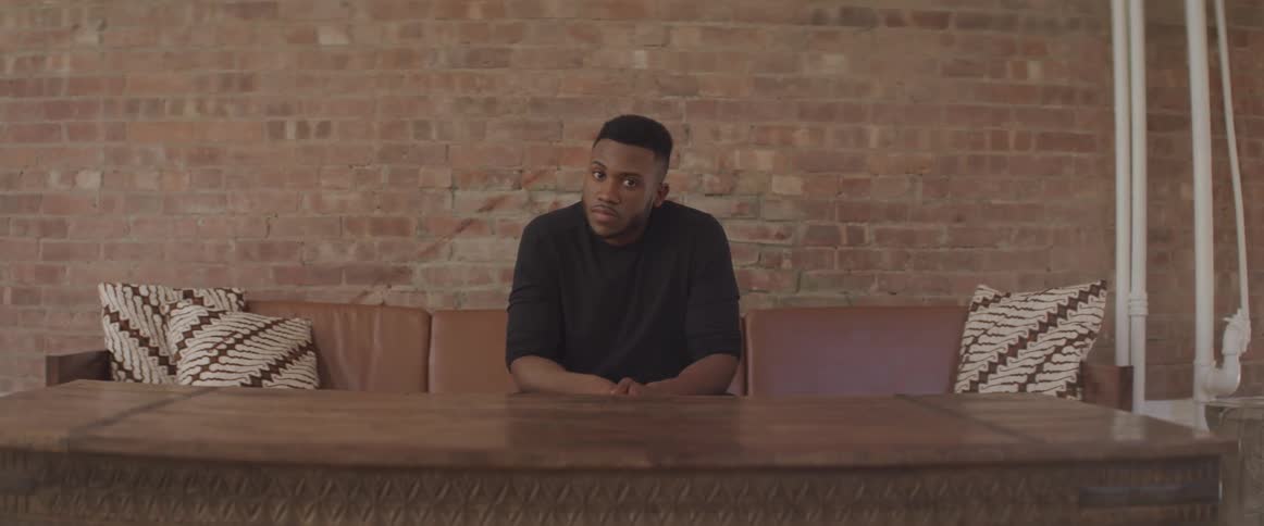 A man sits on the couch