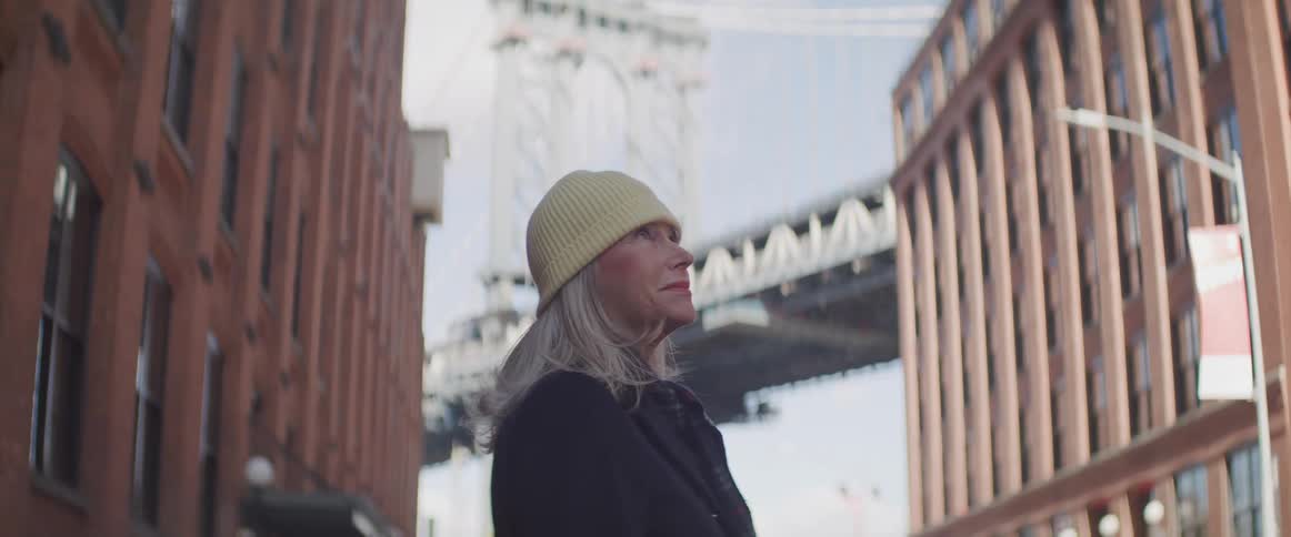 A woman stares at the sky