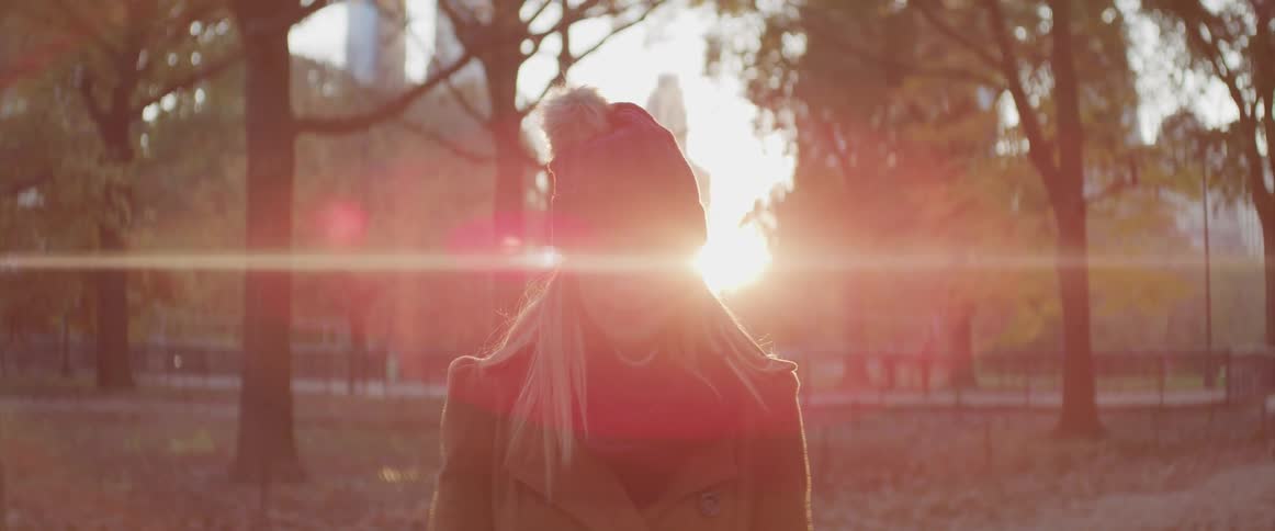 A woman sits in a park