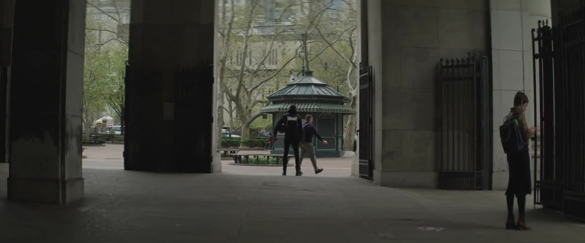A security guard observes the park from an underpass