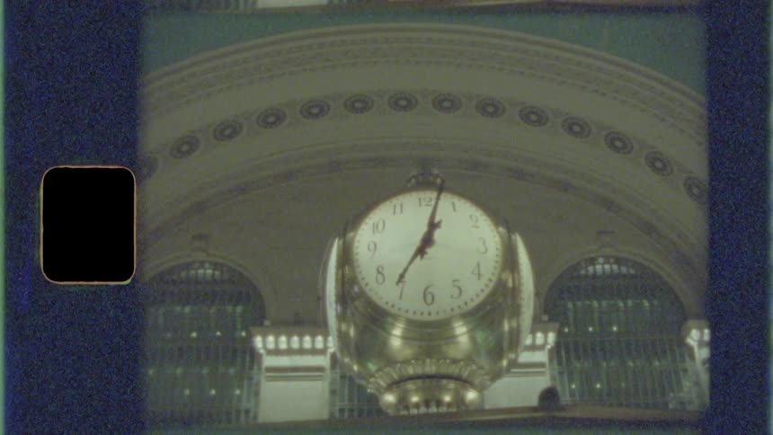 The clock stands just under the arch