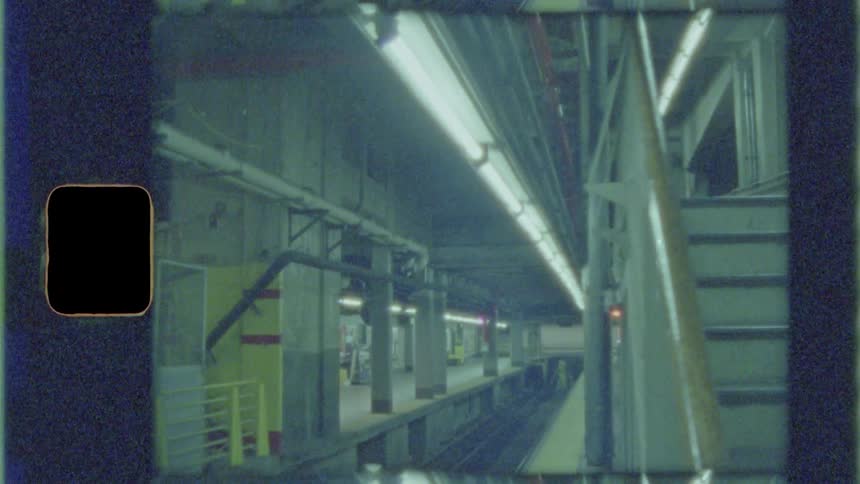 Lights flicker in an underground and empty train platform