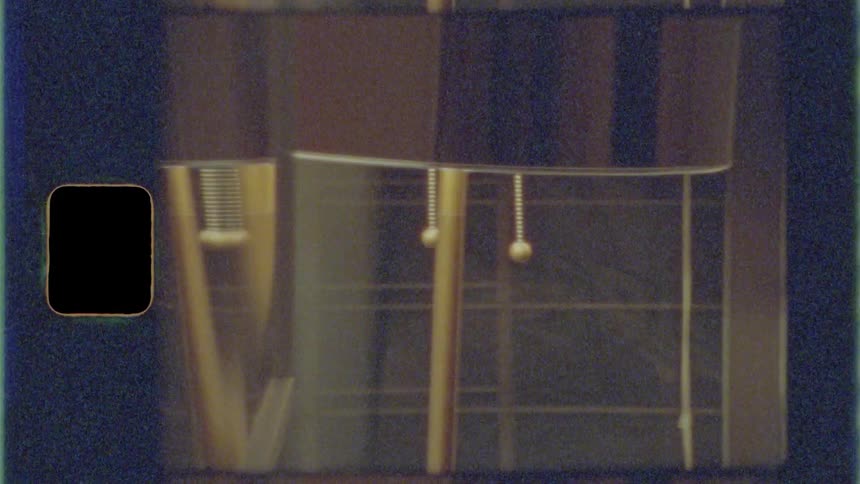 The cord on the lamp swings under the light