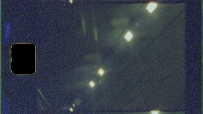 Traveling past a wall with lights on top at night