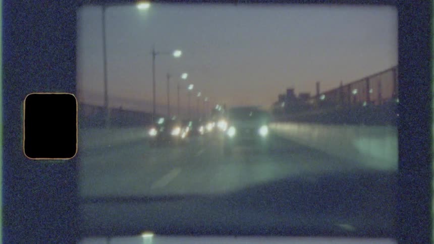 Cars driving on a street in a city