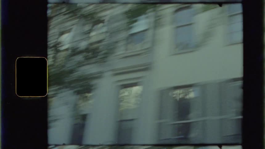 A neighborhood in a city flashes by quickly