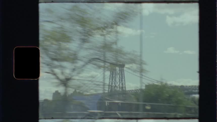 Moving vehicle travels by the park and a bridge