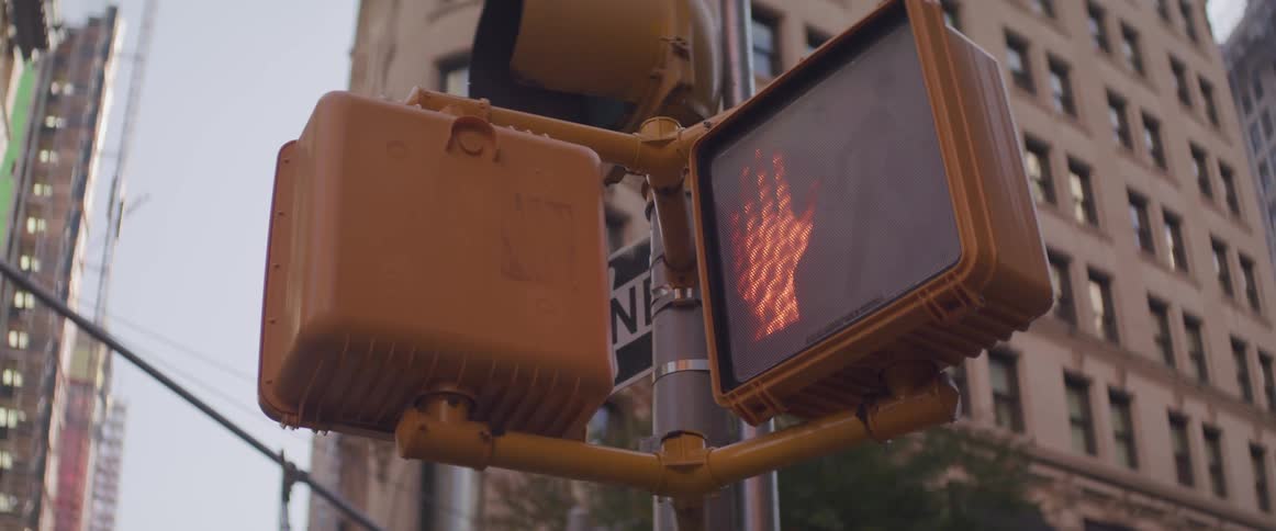 The traffic light shows a dont walk symbol