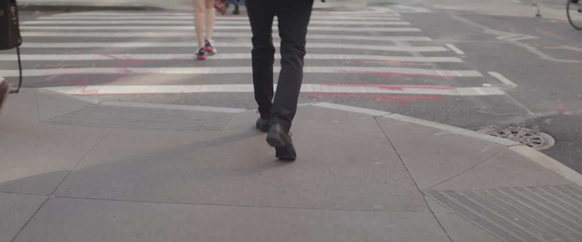 Pedestrians walking down a street