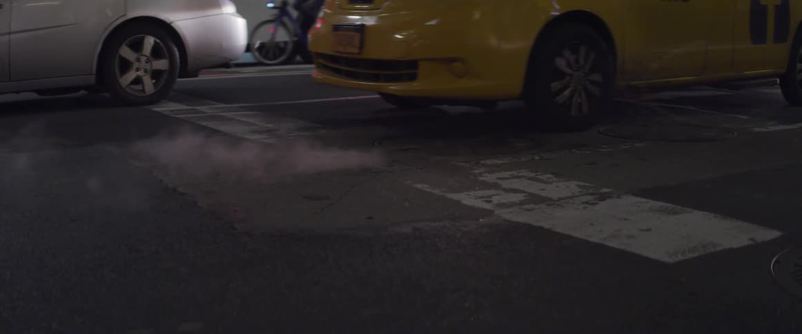 Yellow car pulls up to a line on the road and then stops