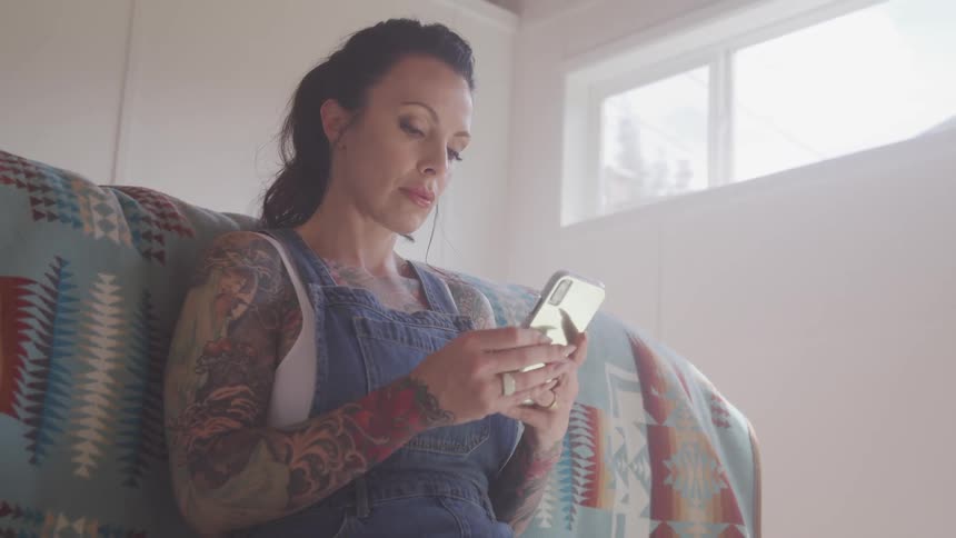 A woman is using her cell phone