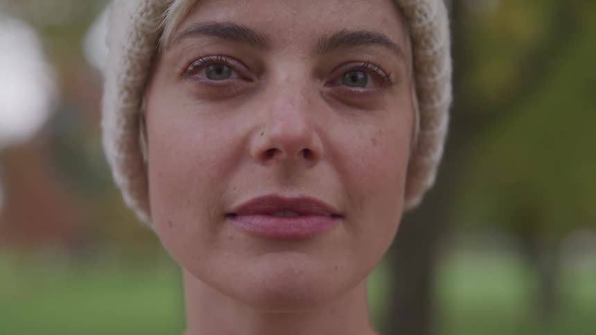 Woman wearing a toque looks at the camera
