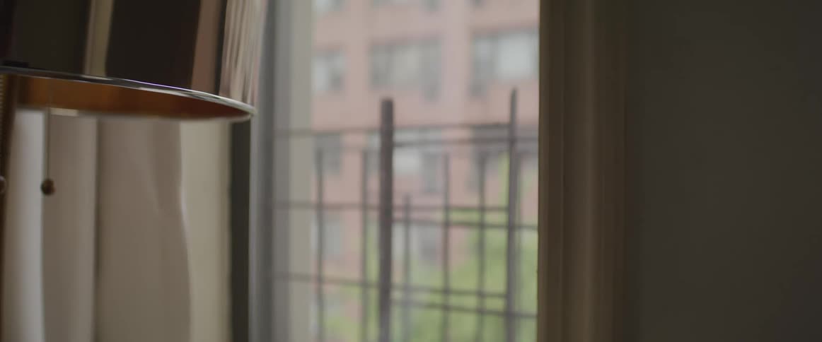 The light is off in the room by the window