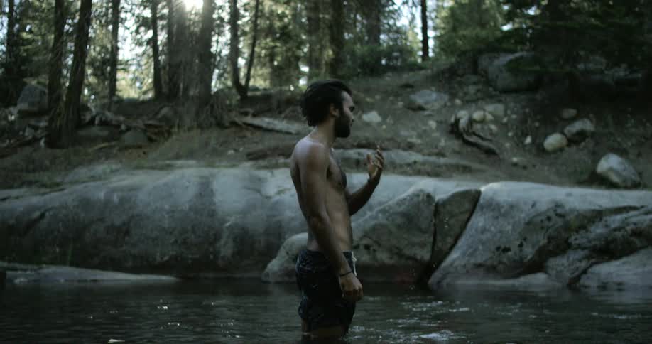 A man is bathing in the lake