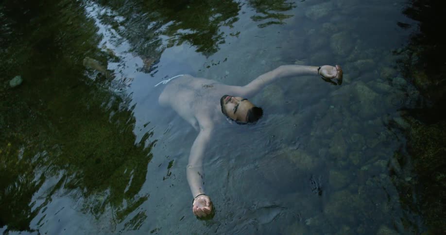 A man is floating in the water