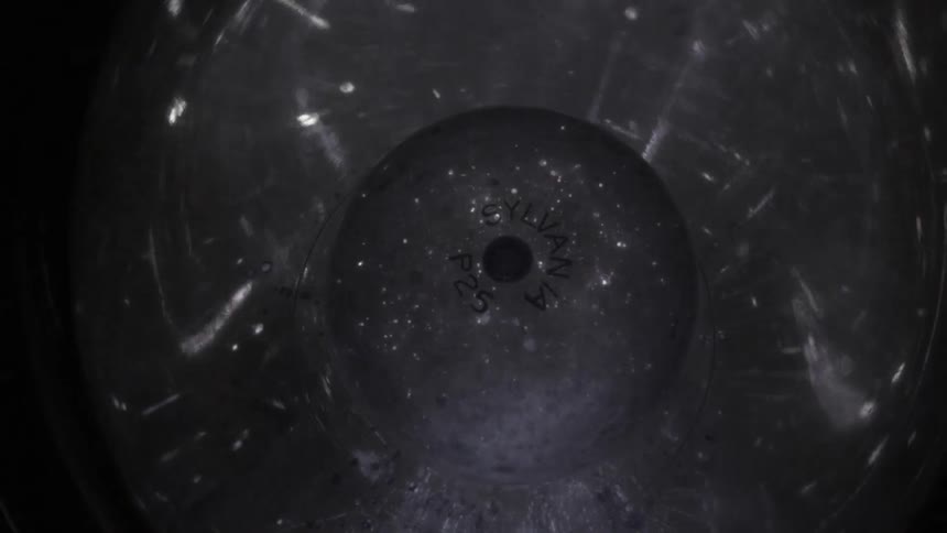 The bulb from a photography lamp flashes on and off