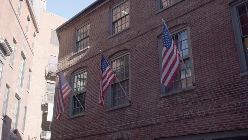 The flags hang from the windows