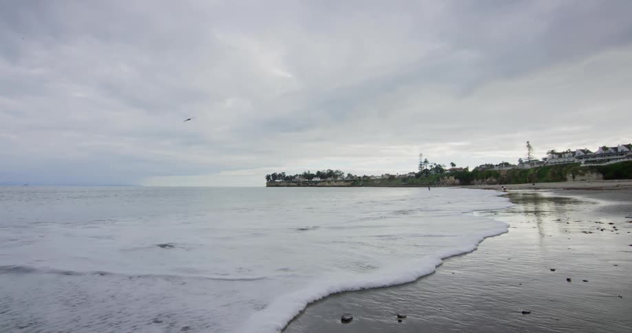 Two people playing on the beach