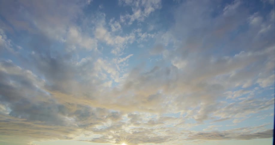 White clouds float under the blue sky