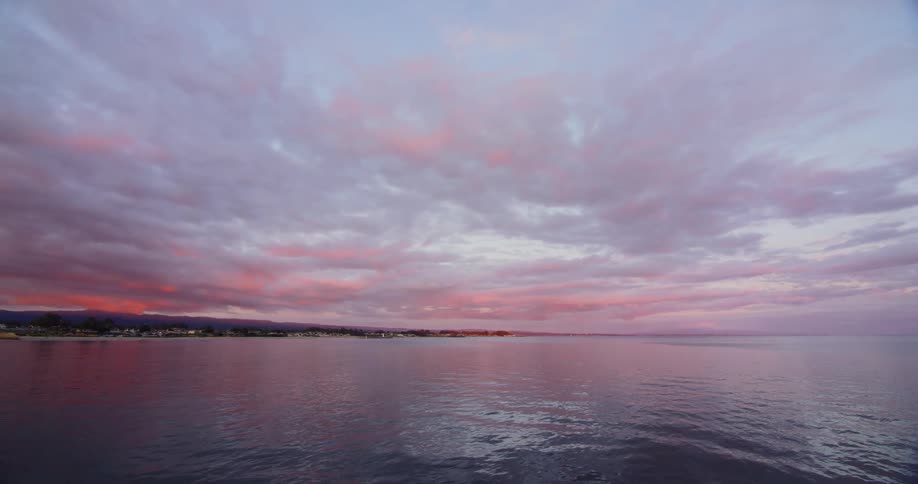 A shoreline sits off to the left of a large body of water