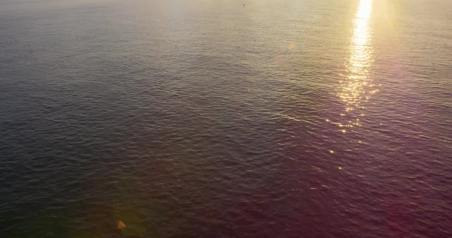 The sun shines down on the ocean