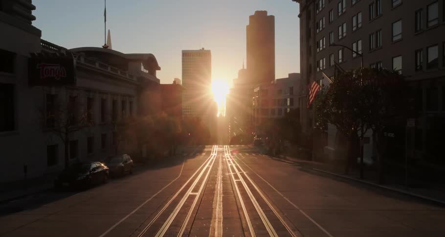 A cable car line run downs a downtown street