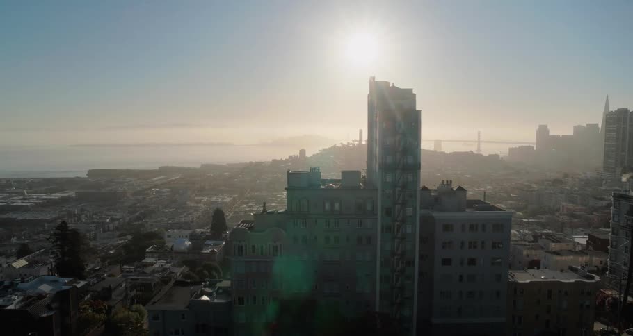 A light fog covers the city ahead