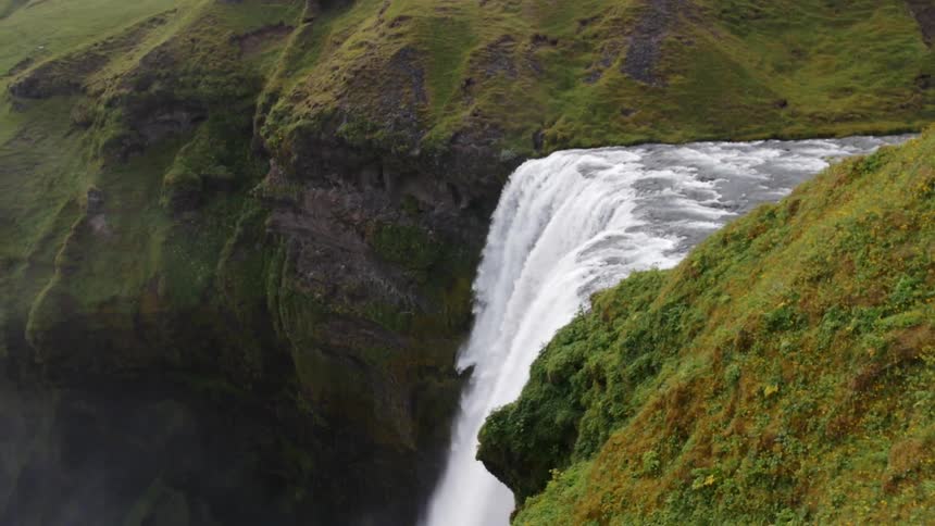 A waterfall cascades over a cliff