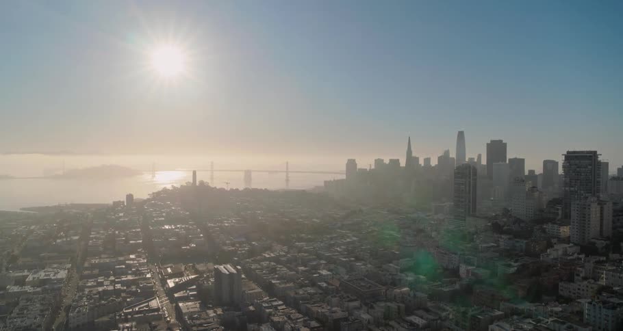 The sun is over the buildings