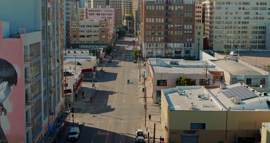 A city street with buildings and vehicles
