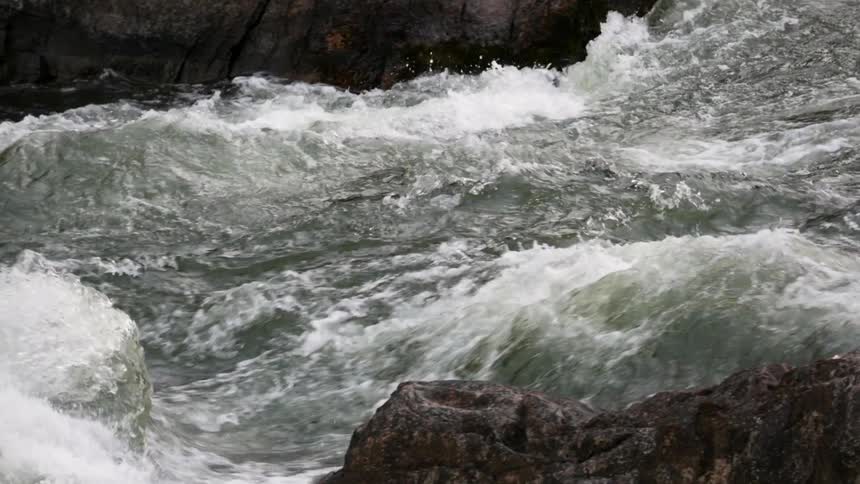 A river flows over rocks