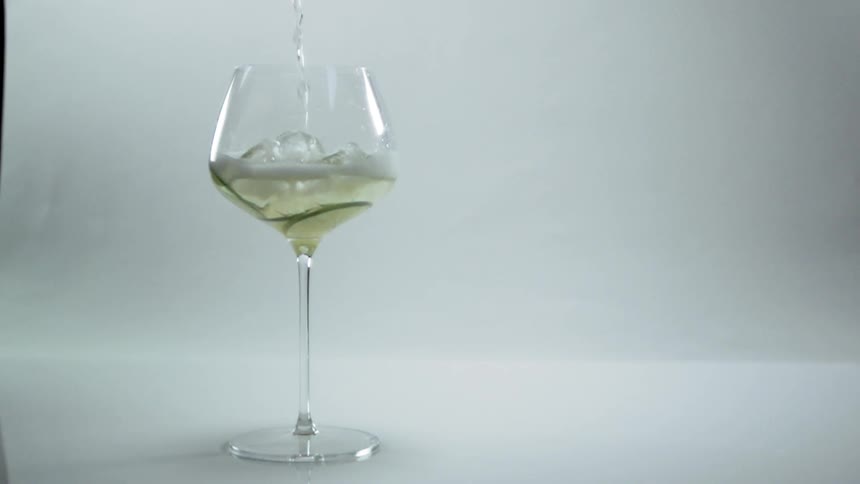Liquid being poured in to a wine glass