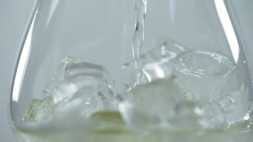 A beverage being poured in to a glass