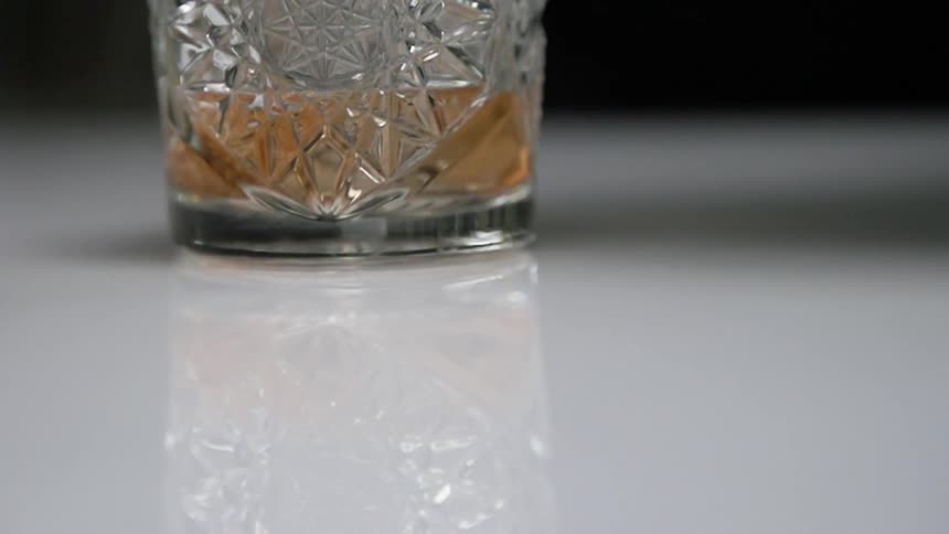The liquid is poured in the glass