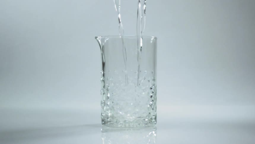Liquid is poured into the glass