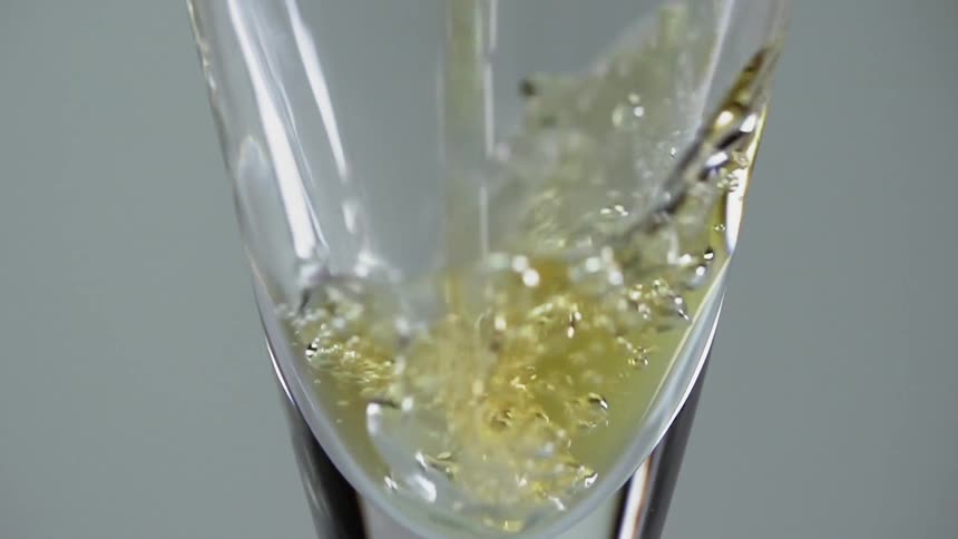 Close up of champagne being poured into a clear glass flute
