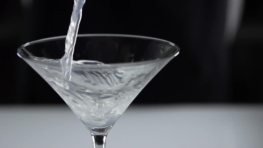 Liquid is being poured into a glass