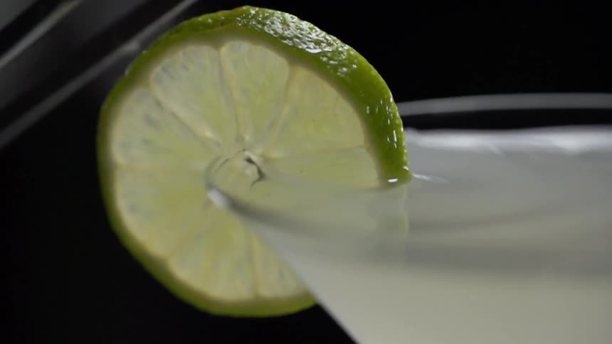 A lime slice is placed on the glass