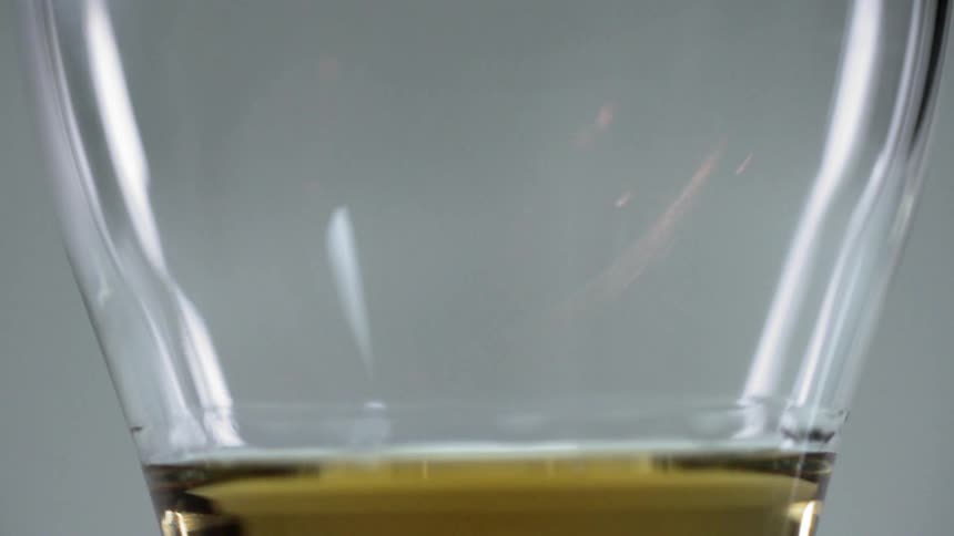 A glass is on display and there is a flame