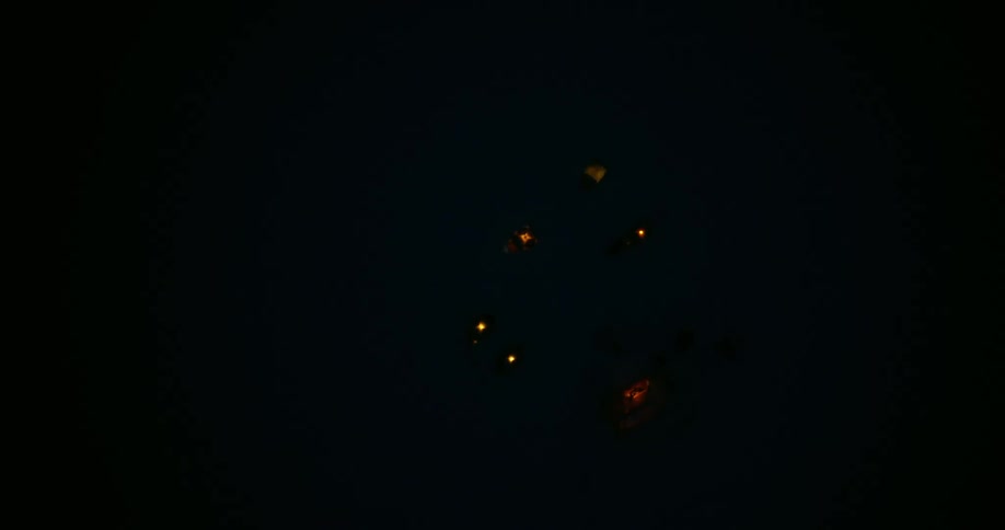 Aerial view of tents lit up at night